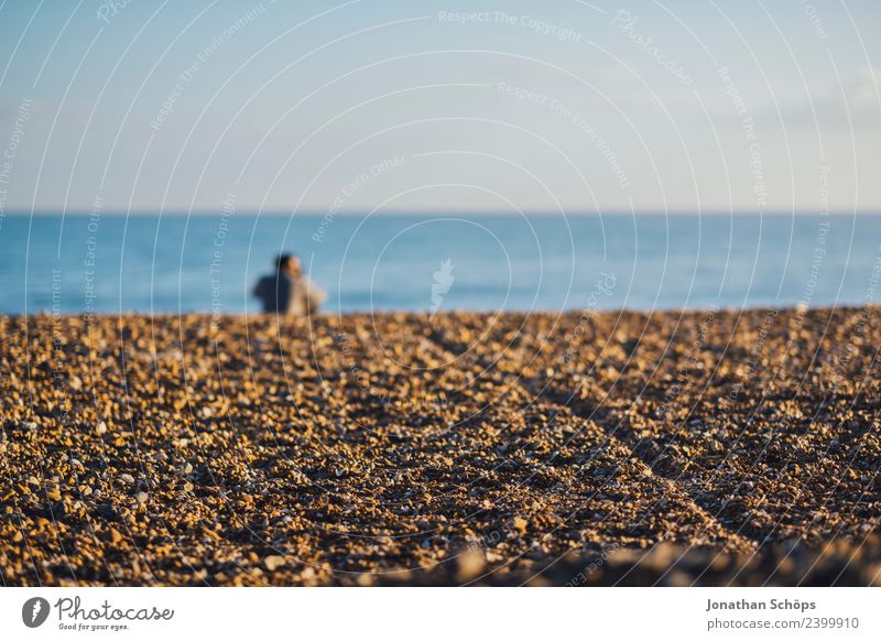 Couple sitting on the beach Partner 2 Human being Nature Sky Cloudless sky Waves Coast Beach Ocean Pebble beach Brighton Great Britain Europe Port City Touch
