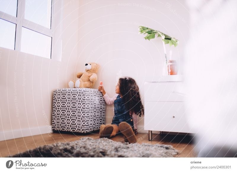 afrcian girl giving teddy sweets at home Happy Beautiful Playing Child Boots Toys Teddy bear Sit Small Cute Bear Home room kid background window Carpet african