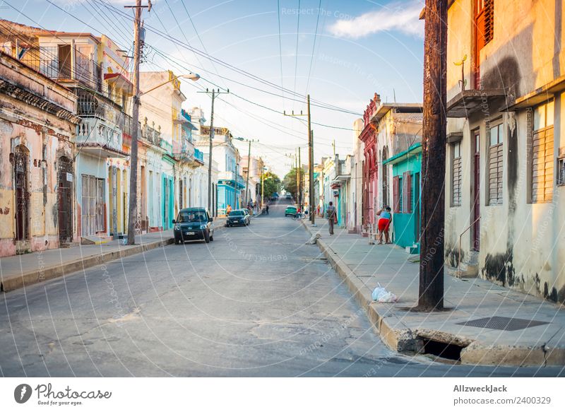 Midday sun on the streets of Cienfuegos Cuba Vacation & Travel Travel photography Street Town Deserted Vintage car Parking Car Summer Blue sky Clouds Pole