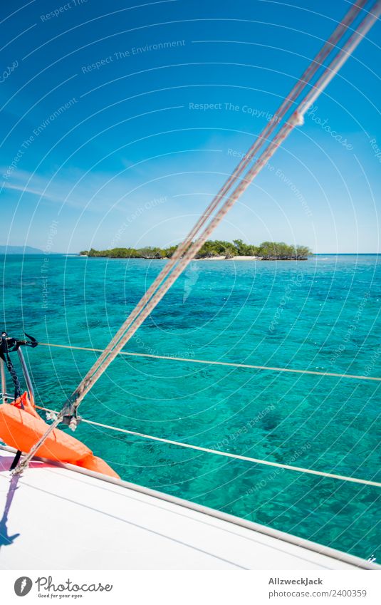 View of a small island in the Caribbean from the boat Day Deserted Island Paradise Clarity Gorgeous Water Ocean Sailing Sailboat Maritime Blue sky Cloudless sky