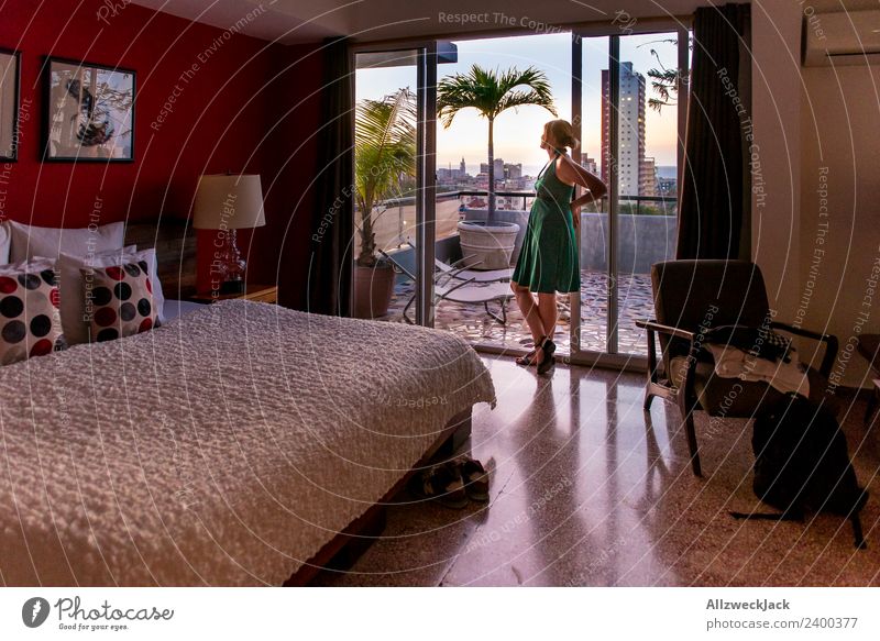 Woman standing on a balcony watching the sunset Cuba Havana Town Island Palm tree Vacation & Travel Travel photography Sunset Summer Beautiful weather Penthouse