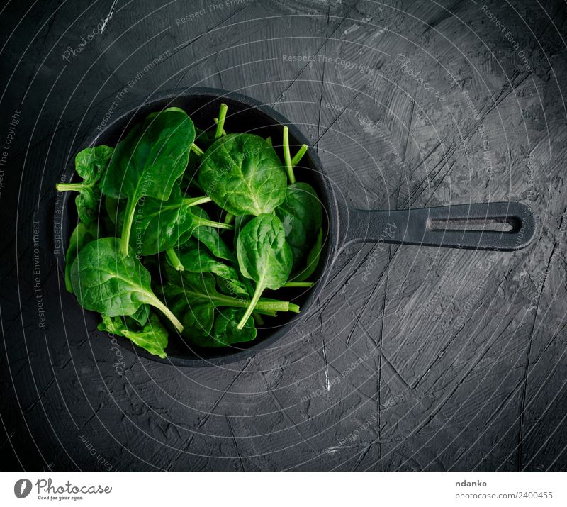 green leaves in a black round frying pan Vegetable Lettuce Salad Herbs and spices Nutrition Vegetarian diet Diet Pan Healthy Eating Table Nature Plant Leaf