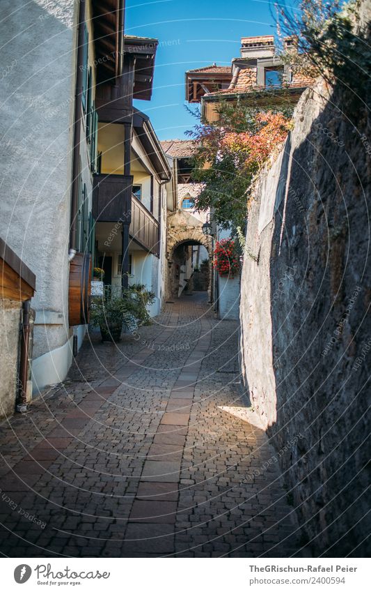 gas Village Blue Gray Green Paving stone Switzerland Street Alley Sky House (Residential Structure) Wall (barrier) Idyll Calm Balcony Colour photo Exterior shot