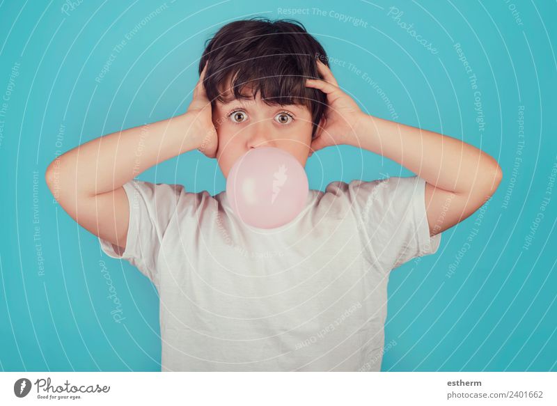 child with chewing gum in your mouth on blue background Food Candy Lifestyle Joy Human being Masculine Child Toddler Infancy 1 8 - 13 years Movement Fitness