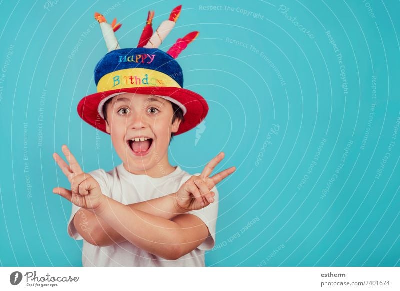 happy boy with birthday hat on blue background Lifestyle Joy Party Event Feasts & Celebrations Fairs & Carnivals Birthday Human being Masculine Child Toddler