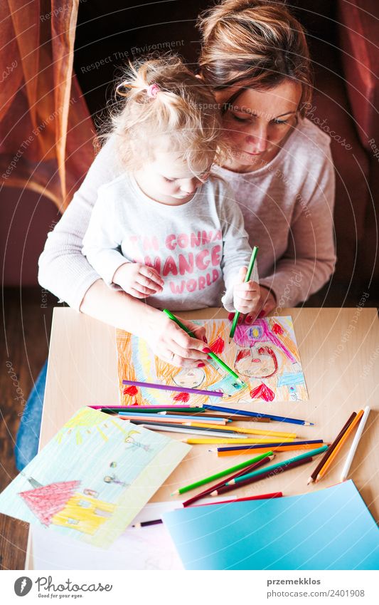 Mom with little daughter drawing the colorful pictures Lifestyle Joy Happy Handcrafts Table Kindergarten Child School Human being Girl Woman Adults Parents