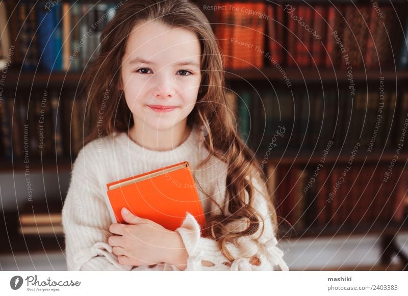 happy smart schoolgirl reading books Reading Child School Classroom Schoolchild Infancy Book Library Smiling Small Smart Concentrate Creativity kid learn