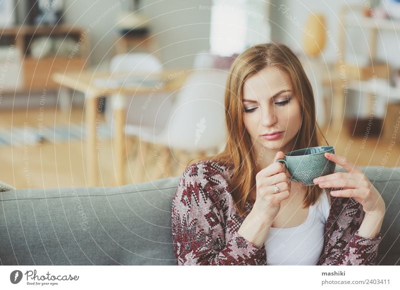 indoor portrait of young thoughtful woman at home Coffee Tea Lifestyle Illness Harmonious Relaxation Flat (apartment) Woman Adults Dream Sadness Modern Natural