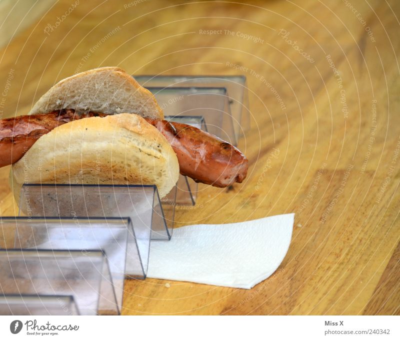 snack Food Sausage Roll Nutrition Fresh Hot Delicious Appetite Snack bar Napkin Wooden table Colour photo Close-up Copy Space right Bratwurst 1 Deserted Bracket
