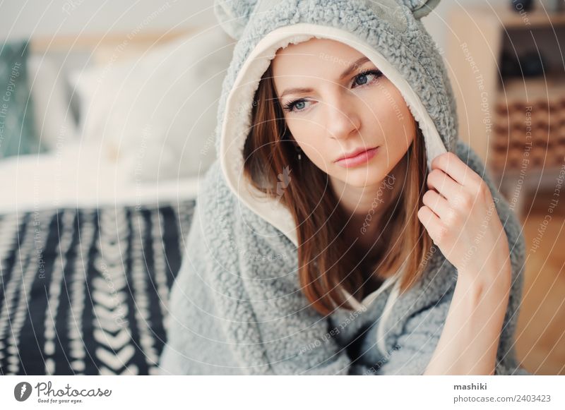 young beautiful woman relaxing at home Lifestyle Relaxation Bedroom Woman Adults Culture Warmth Fashion Sit Dream Funny Modern Natural Gray Loneliness