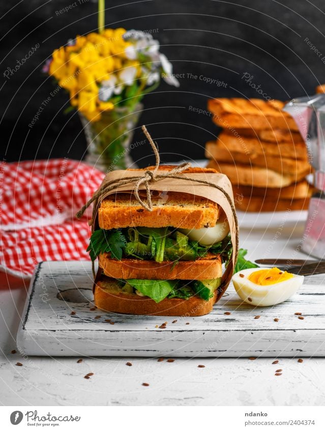 sandwich of French toast and lettuce leaves Meat Vegetable Lettuce Salad Bread Breakfast Lunch Dinner Vegetarian diet Table Flower Fresh Delicious Brown Green