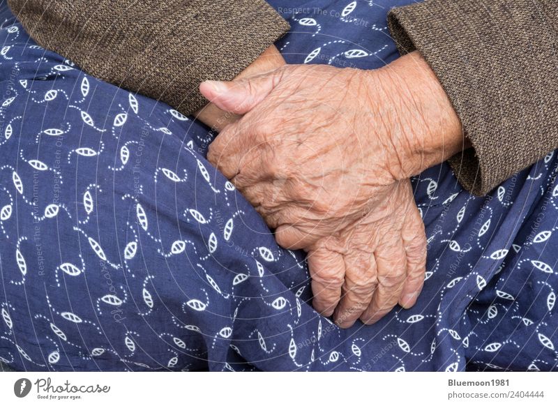A Detail of An Old Woman Hands On Her Traditional Skirt Lifestyle Body Skin Retirement Human being Feminine Adults Grandmother Fingers Cloth Blue