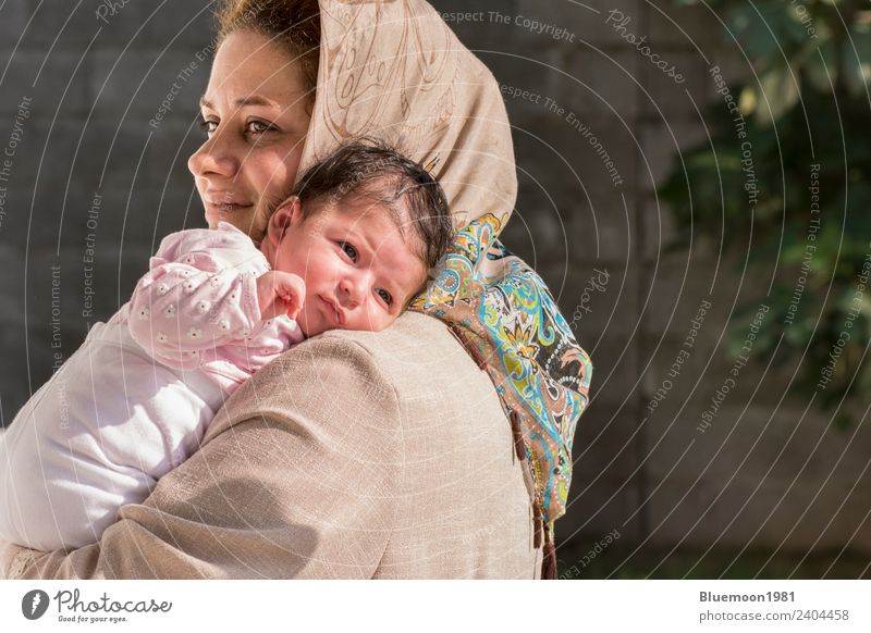 Muslim mother caring a little newborn baby in outdoor Lifestyle Beautiful Relaxation Parenting Child Human being Feminine Baby Woman Adults Parents Mother