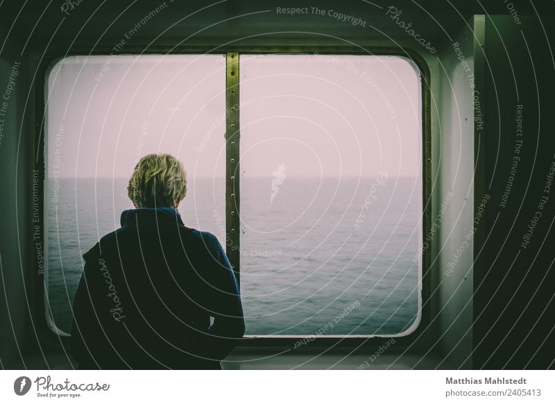 Woman looking out the window of a ship Human being Feminine Adults Life 1 45 - 60 years Window Navigation Passenger ship On board Coat Hair and hairstyles