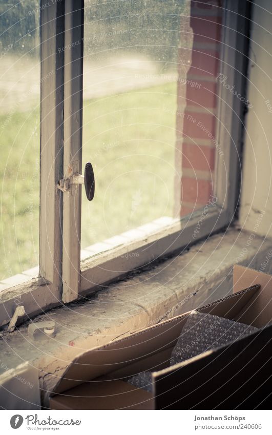 Cardboard box in front of window [rickety, beautiful] Wood Glass Brick Old Esthetic Window Window pane Crate Door handle Sunlight Old building Decline Dirty