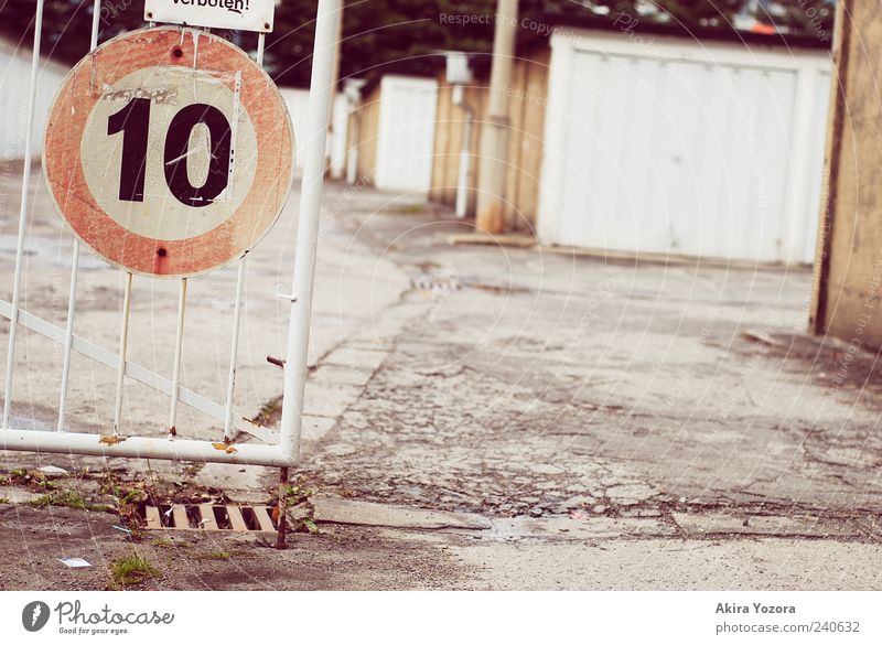 ten Garage Garage door Road sign Old Stand Retro Brown Gray Silver Safety Protection Colour photo Subdued colour Exterior shot Copy Space right