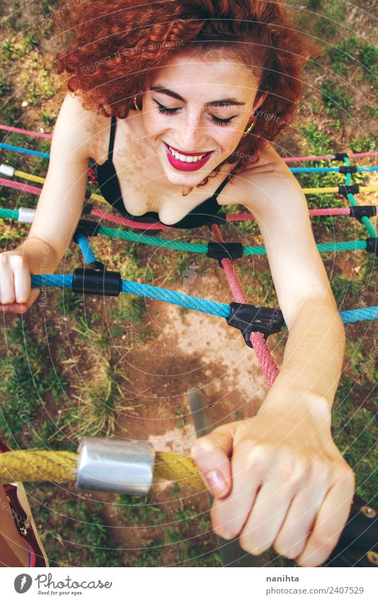 Young redhead woman climbing in a park Lifestyle Style Joy Beautiful Hair and hairstyles Freckles Wellness Fitness Sports Training Practice Human being Feminine