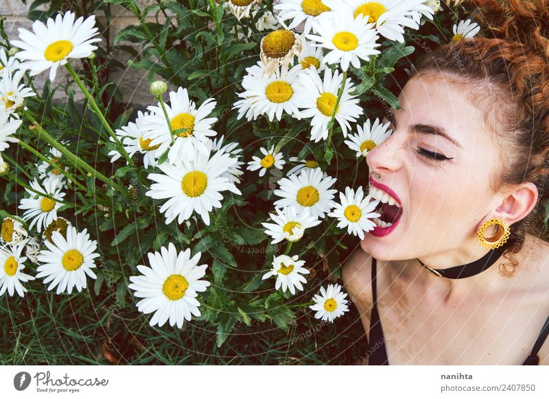 Young woman biting flowers Lifestyle Style Exotic Beautiful Human being Feminine Youth (Young adults) 1 18 - 30 years Adults Environment Nature Plant Spring
