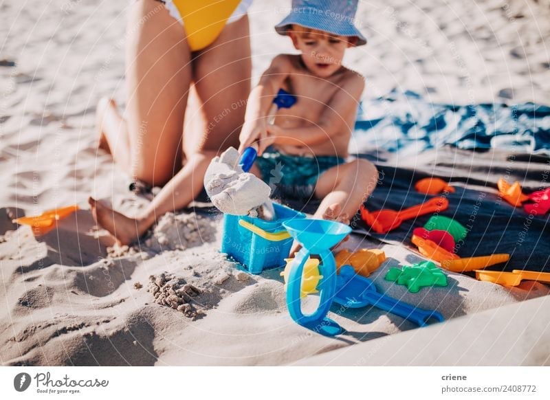 little caucasian boy playing in the sand at the beach Lifestyle Joy Happy Playing Vacation & Travel Summer Sun Beach Ocean Child Human being Boy (child) Infancy