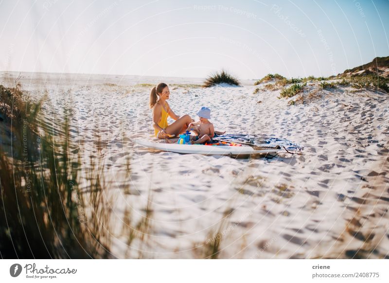 happy caucasian mother and son sitting in dunes Lifestyle Happy Vacation & Travel Summer Beach Child Boy (child) Woman Adults Man Parents Mother