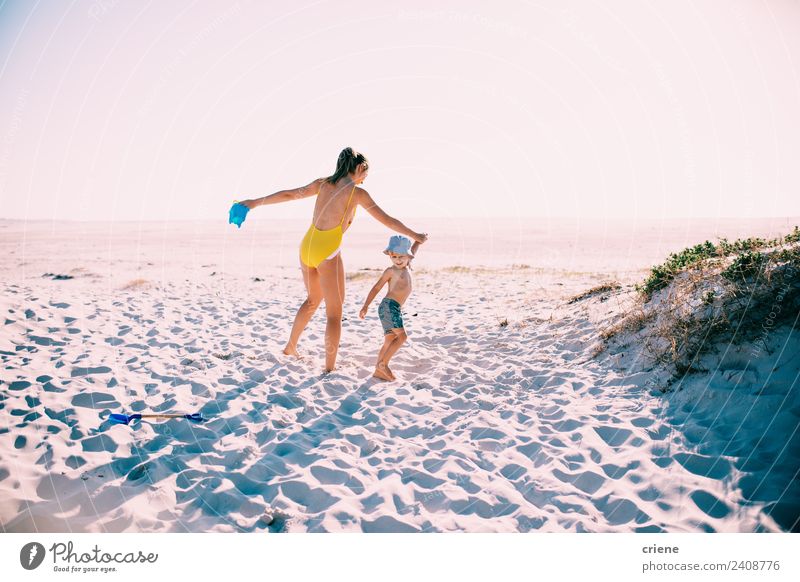 caucasian mother and son having fun at the beach Lifestyle Happy Beautiful Vacation & Travel Summer Sun Beach Boy (child) Woman Adults Mother Family & Relations