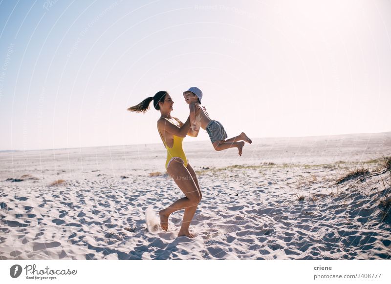 caucasian mother and son having fun at the beach Joy Happy Beautiful Playing Vacation & Travel Summer Beach Child Boy (child) Woman Adults Mother Infancy Sky