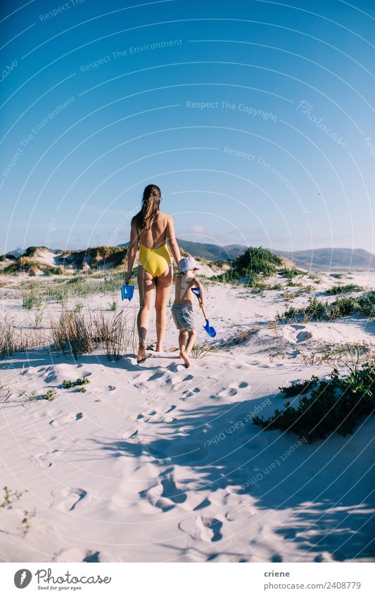 mother and sun having a walk at the beach Vacation & Travel Summer Beach Child Boy (child) Woman Adults Mother Nature Sand Sky Grass Coast Hat Brunette Together