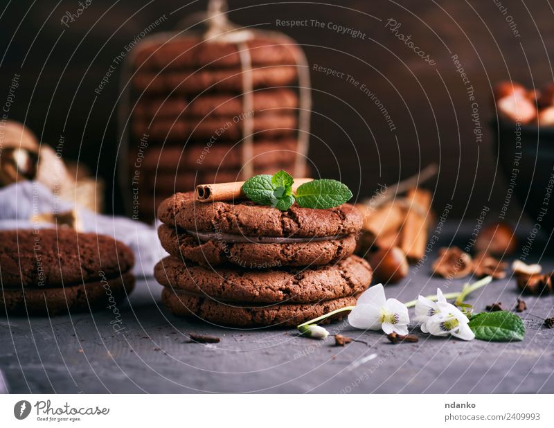 round chocolate chip cookies Dessert Candy Nutrition Flower Dark Delicious Brown Black background food Stack sweet Baking biscuit holiday Tasty Snack Mint