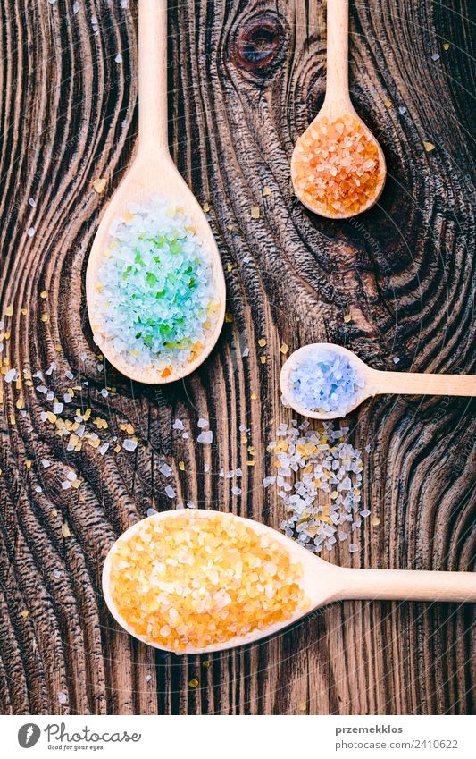 Colorful sea salt in wooden spoons put on old wooden table Spoon Lifestyle Medical treatment Wellness Relaxation Spa Table Nature Container Wood Natural Above