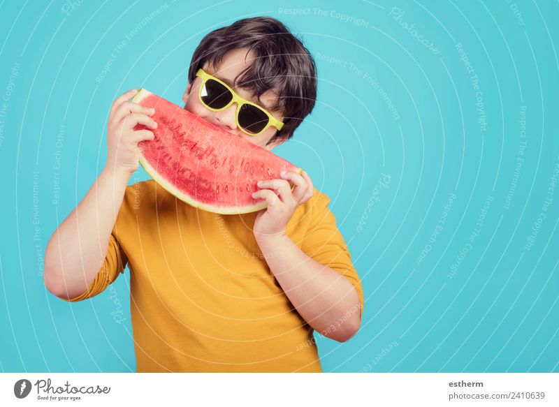 Happy child with sunglasses eats watermelon Food Fruit Dessert Nutrition Eating Organic produce Lifestyle Joy Human being Masculine Child Toddler Boy (child)