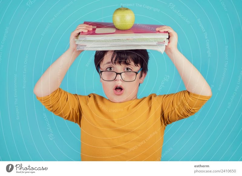 surprised boy with books and apple Apple Lifestyle Education Child School Study Student Human being Masculine Toddler Boy (child) Infancy 1 8 - 13 years