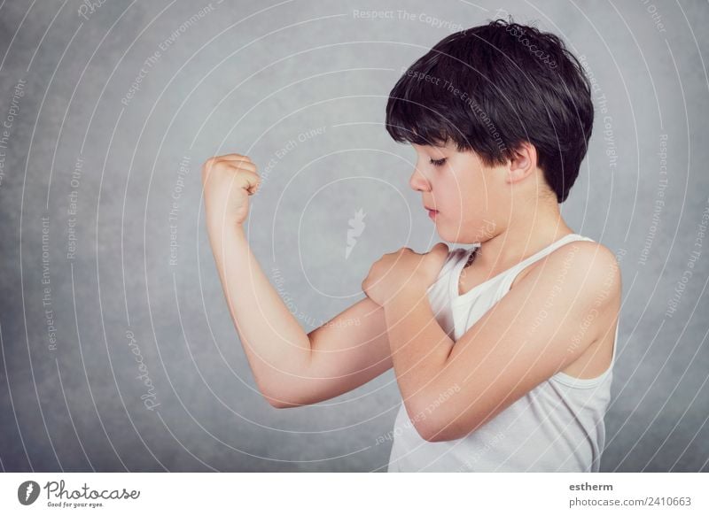 kid showing his muscles Lifestyle Wellness Sports Fitness Sports Training Success Human being Masculine Child Toddler Infancy 1 8 - 13 years Think Fight