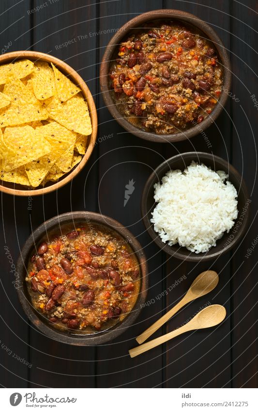 Chili con Carne Meat Vegetable Dark chili stew Meal Dish food Beef Ground minced mincemeat Tomato Home-made Rice chips corn cooking Rustic overhead legume Pulse