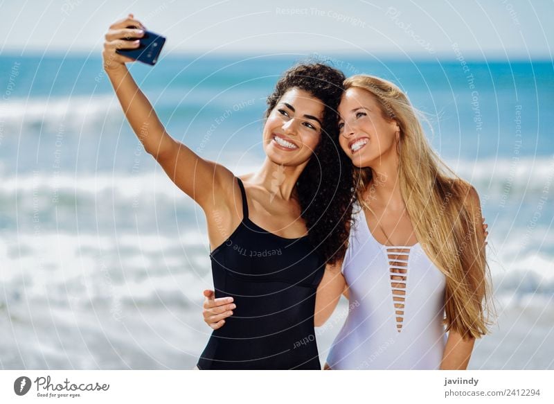 Two girls taking selfie photograph with smart phone Lifestyle Joy Happy Beautiful Body Leisure and hobbies Vacation & Travel Tourism Summer Beach Human being