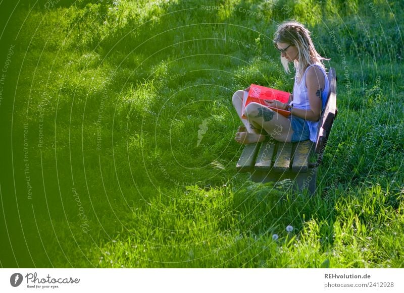 Jule Young woman with dreads reading on a bench in the country Well-being Contentment Relaxation Calm Study University & College student Human being Feminine