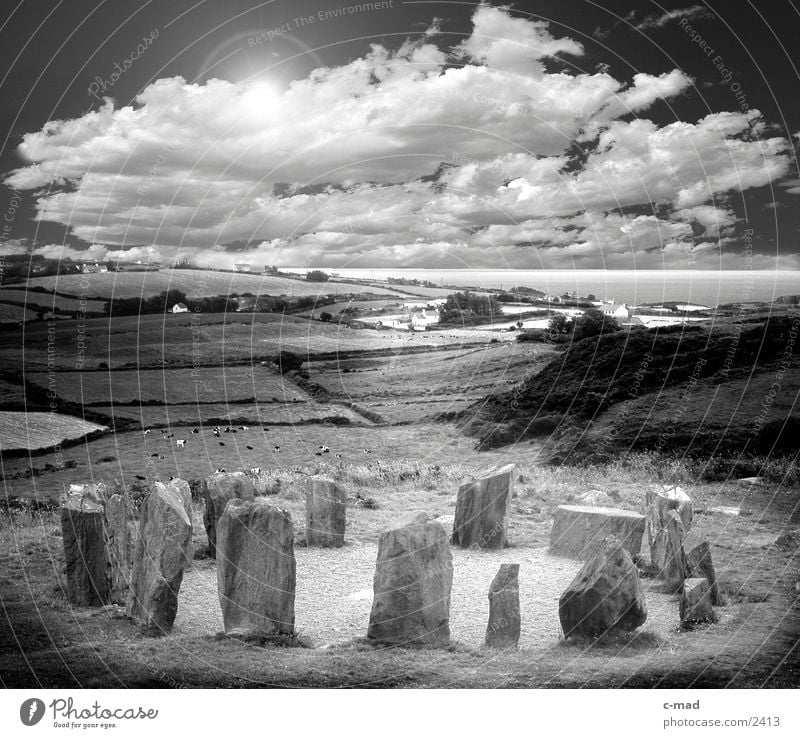 Stonecircle in Ireland Clouds Stone circle Stone block Celts Meadow Grass Moody Manmade structures Field Ocean megalite stonecircle Black & white photo Sun
