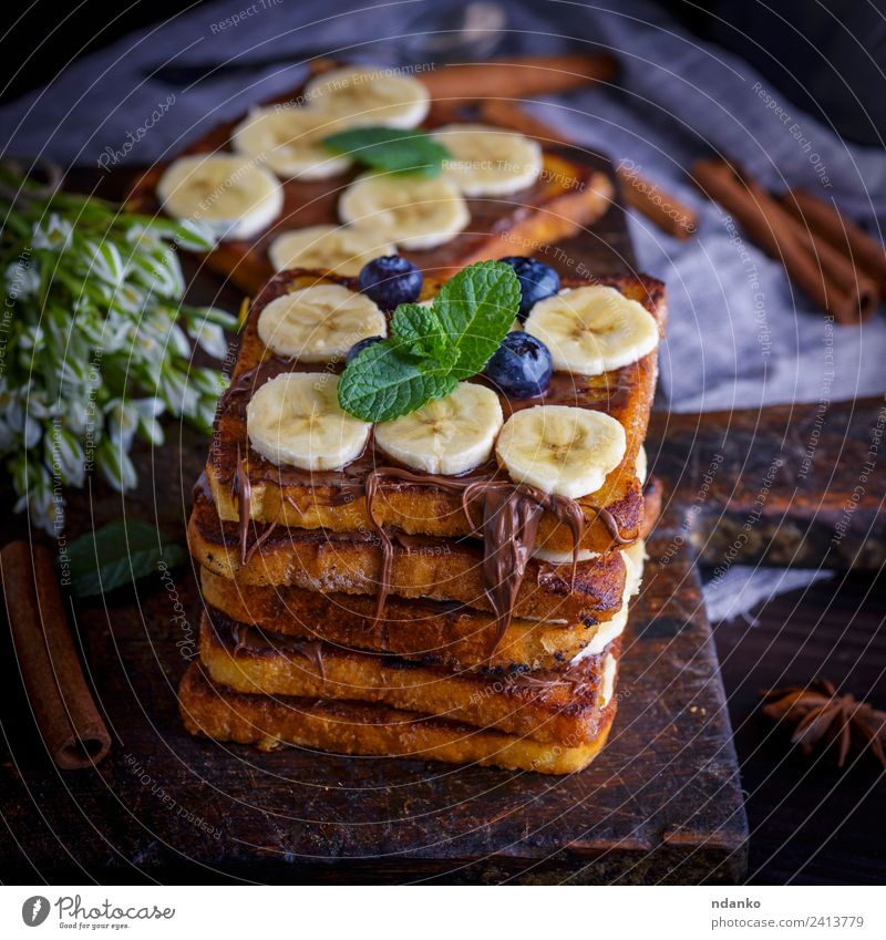 bread slices with chocolate Fruit Bread Dessert Candy Nutrition Breakfast Flower Wood Eating Fresh Delicious Above Tradition toast french Banana background food