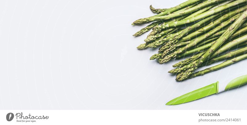 Green asparagus with knife Food Vegetable Nutrition Organic produce Vegetarian diet Diet Knives Style Design Healthy Healthy Eating Table Restaurant Asparagus