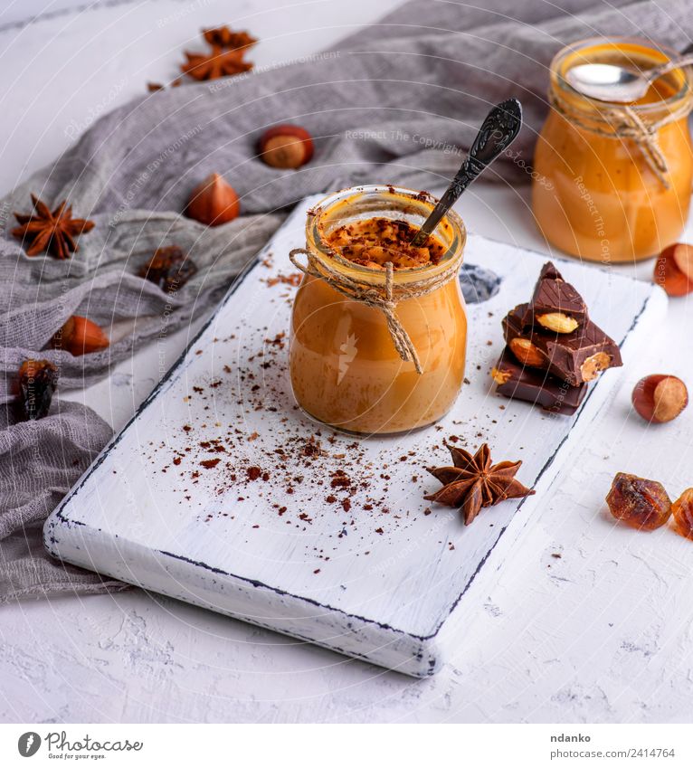 Caramel dessert Toffee Dessert Candy Spoon Table Wood Delicious Above Brown Sauce background jar toffee pouring sweet Sugar Home-made food Sticky Syrup glass