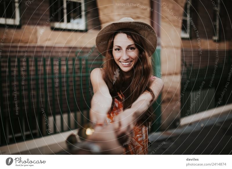 Cute woman holding her boyfriend hand and looking at him while he takes a photo of her. Lifestyle Joy Vacation & Travel Trip Adventure Freedom Human being Woman