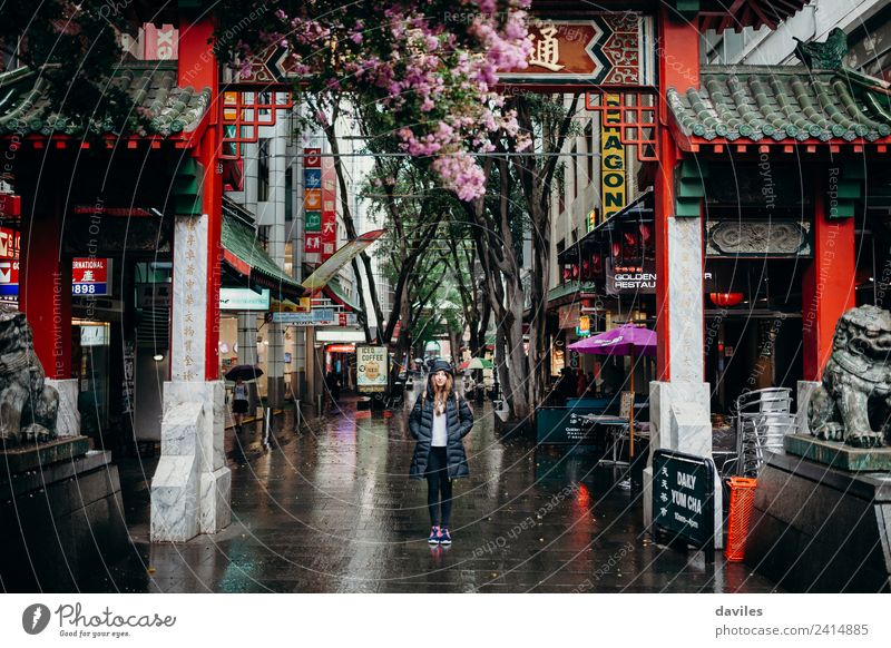 Young woman standing under Chinatown neighbourhood arch in Sydney city, Australia. Shopping Vacation & Travel Tourism Business Feminine Youth (Young adults)