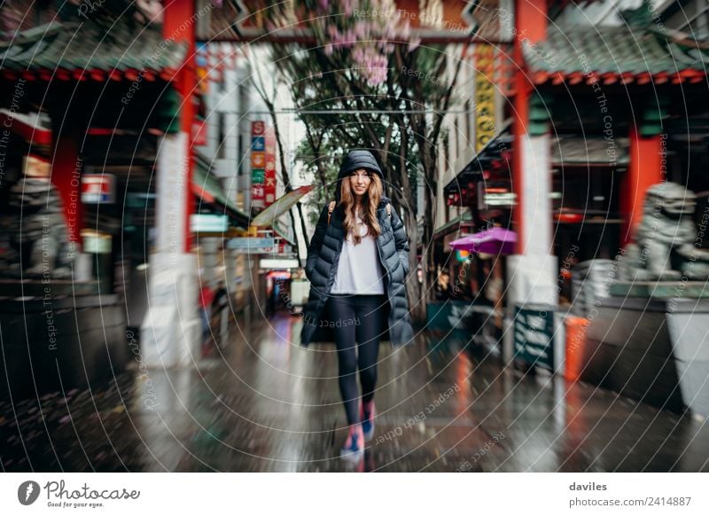 Young white woman walking across Chinatown neighbourhood in Sydney city, Australia. Shopping Vacation & Travel Tourism Business Human being Young woman