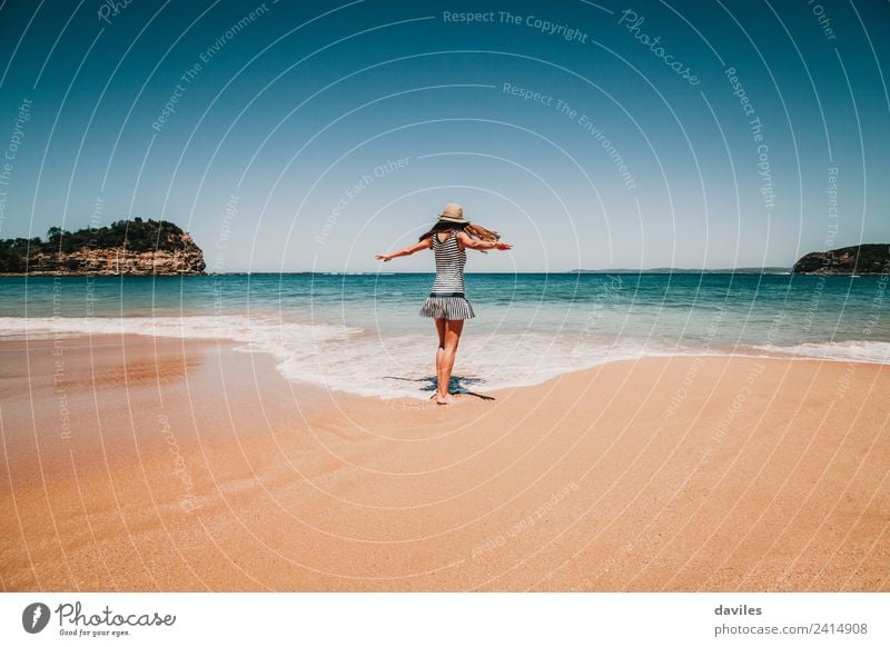 Woman dancing on the beach sand, barefoot, in the sea shore in Australia. Lifestyle Joy Beautiful Wellness Leisure and hobbies Vacation & Travel Adventure