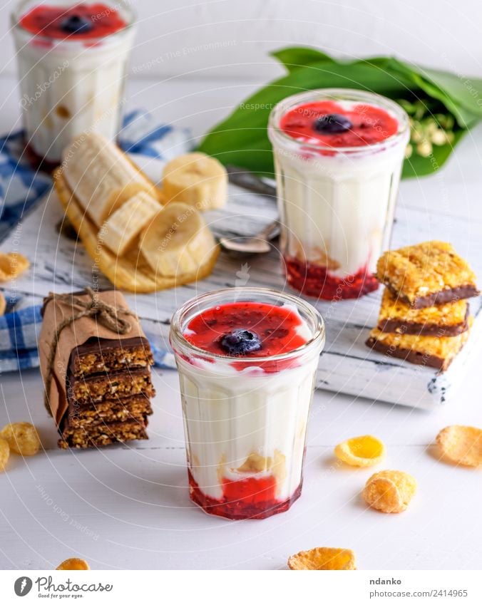homemade yogurt in transparent glass Yoghurt Dairy Products Jam Nutrition Breakfast Diet Beverage Glass Spoon Table Wood Eating Fresh Natural Above Red White