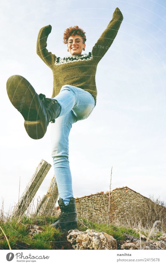 Low view of a happy redhead woman outdoors Lifestyle Style Joy Wellness Freedom Human being Feminine Young woman Youth (Young adults) 1 18 - 30 years Adults