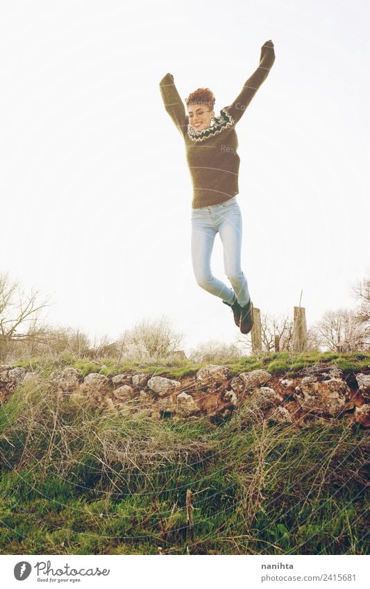 Young and happy woman having fun and jumping outdoors Lifestyle Joy Healthy Wellness Vacation & Travel Adventure Far-off places Freedom Sun Human being Feminine