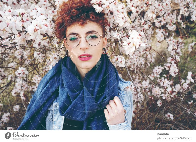 Beautiful redhead woman surrounded by flowers in spring Lifestyle Style Hair and hairstyles Skin Face Wellness Senses Fragrance Human being Feminine Young woman