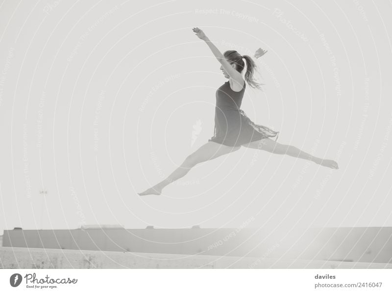 Black and white portrait of woman jumping during classic dance ballet session. Beautiful Freedom Dance Sports Human being Woman Adults Youth (Young adults) 1