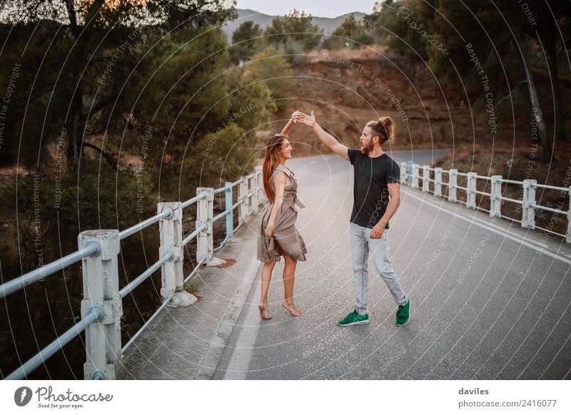 Cool couple dancing together on a bridge Lifestyle Style Joy Leisure and hobbies Human being Woman Adults Man Couple Partner 2 18 - 30 years