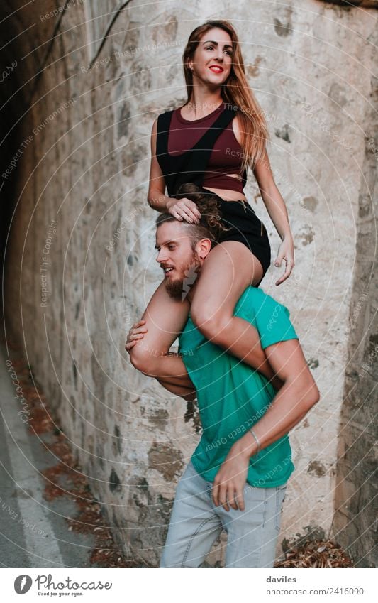Young rad couple posing against a stone wall Lifestyle Joy Vacation & Travel Trip Human being Woman Adults Man Couple 2 18 - 30 years Youth (Young adults)